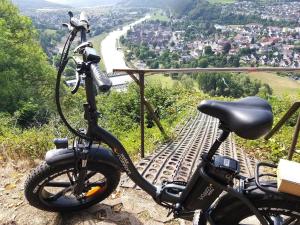 a bike parked on top of a hill with a view at Altstadthaus Neubert in Bodenwerder