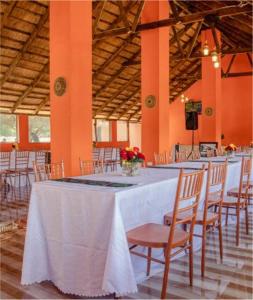a room with a long table with chairs at Kasbek Lodge & Tours in Kazungula
