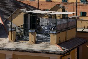 a balcony on top of a building at La mansarda sul Porto in Camogli