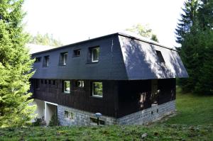 a house with a black roof at Penzion Svojanov in Svojanov