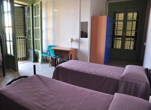 Postel nebo postele na pokoji v ubytování Litus Roma Hostel + 37 fotografií