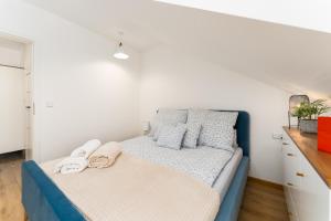 Łóżko lub łóżka w pokoju w obiekcie Apartament Słoneczny przy morzu z klimatyzacja