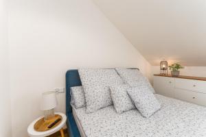 Łóżko lub łóżka w pokoju w obiekcie Apartament Słoneczny przy morzu z klimatyzacja