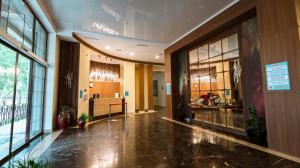 a lobby of a building with a lobby at VOGUE HOTEL RESORT AND SPA - Nabran in Nabran