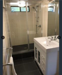 a bathroom with a sink and a shower at Family Beach Home Dromana in Dromana