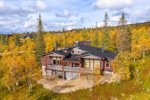 an aerial view of a house in the woods at Kiisa A and B with aurora rooms in Saariselka