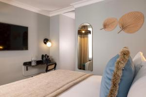 Ένα ή περισσότερα κρεβάτια σε δωμάτιο στο Hôtel Fior d'Aliza