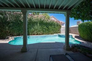 a swimming pool under a gazebo at Brilliant 4 Bedroom House With Pool! in Las Vegas