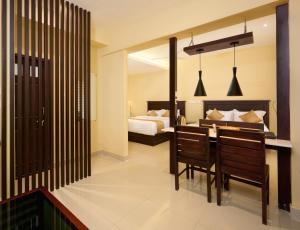 Postel nebo postele na pokoji v ubytování Thekkady Gavi Suites