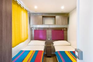 Postel nebo postele na pokoji v ubytování Camping Grande Italia Stromboli