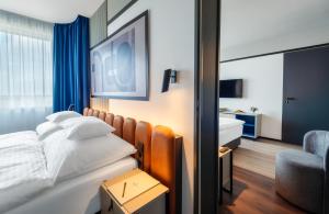 Postel nebo postele na pokoji v ubytování Hunguest Bük - ex Répce és Répce Gold