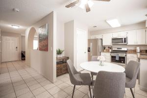 a kitchen and dining room with a table and chairs at Splendid House With Pool! in Las Vegas