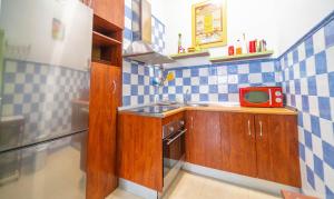 Kuchyň nebo kuchyňský kout v ubytování Bonito Apartamento