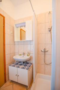 Koupelna v ubytování Apartments Taya + 37 fotografií