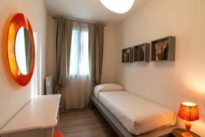 Postel nebo postele na pokoji v ubytování Bocelli Guest House