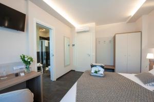 Postel nebo postele na pokoji v ubytování Brichett Deluxe Rooms
