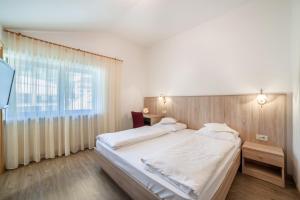 Postel nebo postele na pokoji v ubytování Gartenheim App Elisabeth