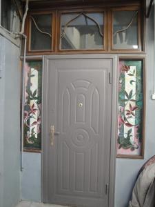 a front door of a building with stained glass at apartament oriental tale in old cyti Baku in Baku