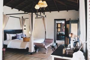 Voodi või voodid majutusasutuse Sriwilai Sukhothai toas