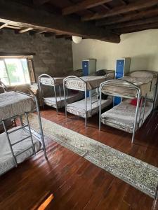 a group of bunk beds in a room at Albergue Rectoral de Romean in Lugo