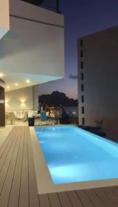 a large swimming pool on top of a building at Luna Boutique Hotel in Mindelo
