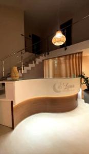 a lobby with a table and some stairs at Luna Boutique Hotel in Mindelo