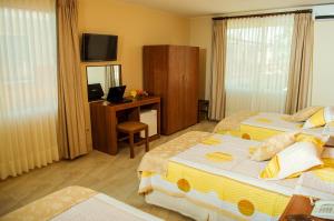 Postel nebo postele na pokoji v ubytování Hotel Mitru - Tarija