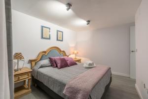 Łóżko lub łóżka w pokoju w obiekcie The Bullring Suites