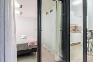 Łóżko lub łóżka w pokoju w obiekcie The Bullring Suites