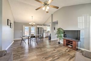 a living room with a dining room table and a ceiling fan at Classic Murfreesboro Home with Grill and Yard! in Murfreesboro