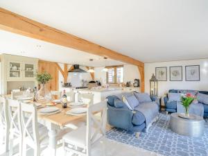 a kitchen and living room with a table and a couch at Hares Furrow - Uk12607 in Burton Overy