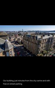 a view of a city with buildings and a city street at Stunning apartment on Perth Rd-mins from City Centre Dundee in Dundee
