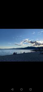 a view of a beach with people on the sand at Studio apartman Noa in Rijeka