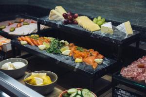 a buffet of different types of food on display at Crowne Plaza Dublin Airport, an IHG Hotel in Santry