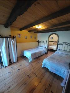 Кровать или кровати в номере Las Peonías Casa Rural