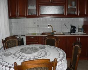 a kitchen with a table with a plate on it at Effrosyni's House in Kanália