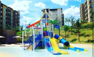a water park with a water slide in a playground at Prive Praias do Lago Eco Resort in Caldas Novas