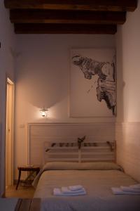 A bed or beds in a room at 4 Camere A Trani