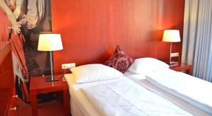 En eller flere senger på et rom på Am Neutor Hotel Salzburg Zentrum