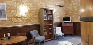 Μια τηλεόραση ή/και κέντρο ψυχαγωγίας στο Appartement Le Cardinal