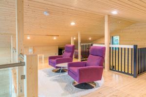 Posezení v ubytování Mustikkakallio Luxury Villa