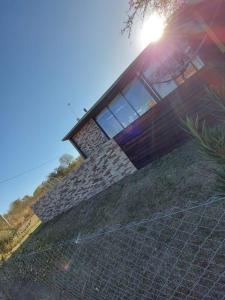 a house with a fence in front of it at SARA HOUSE LARGE in Santa Rosa de Calamuchita