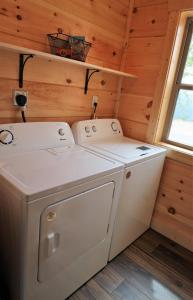 a washer and dryer in a tiny house at Woodland Cove in Waldens Creek