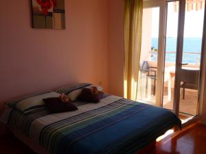 Postel nebo postele na pokoji v ubytování Apartments Jana