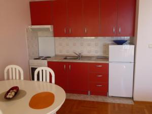 Kuchyň nebo kuchyňský kout v ubytování Apartments Jana
