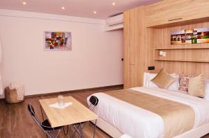 a bedroom with a large bed and a table at Villa Arabic House Pool & SPA, Marrakech in Marrakech +78 photos