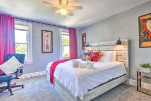 a bedroom with a bed and a ceiling fan at Charming Baltimore Home with Deck and Fire Pit! in Baltimore