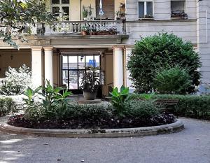 a building with plants in front of it at Turul Apartment Budapest in Budapest