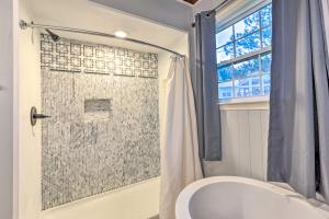 a bathroom with a shower with a toilet and a sink at Waterfront Home Spectacular On-Site Fishing! in Panacea +25 photos