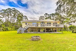 a large yellow house with a large yard at Waterfront Home Spectacular On-Site Fishing! in Panacea